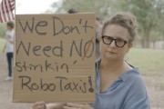 在线解梦特斯拉在得州奥斯汀遭遇抗议活动：反对马斯克Robotaxi计划
